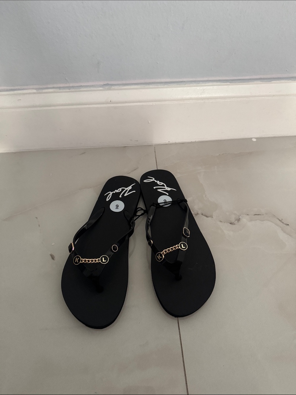 Black Thong Sandals with Gold Chain Accent